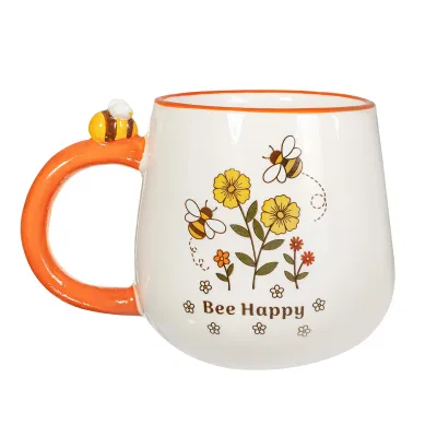 Detalle de la taza retro "Bee Happy" con asa naranja en forma de panal y diseño de abejas y flores amarillas - Happyideas