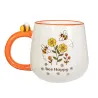 Detalle de la taza retro "Bee Happy" con asa naranja en forma de panal y diseño de abejas y flores amarillas - Happyideas