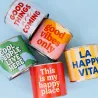 Velas aromáticas en lata de colores con frases positivas, colección Happyideas