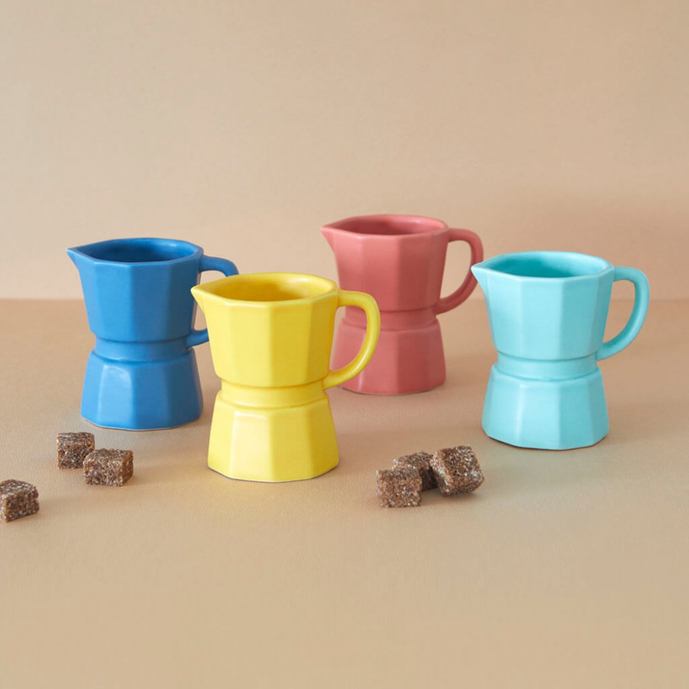 Set of funny cups for a coffee with milk in the shape of a coffee pot